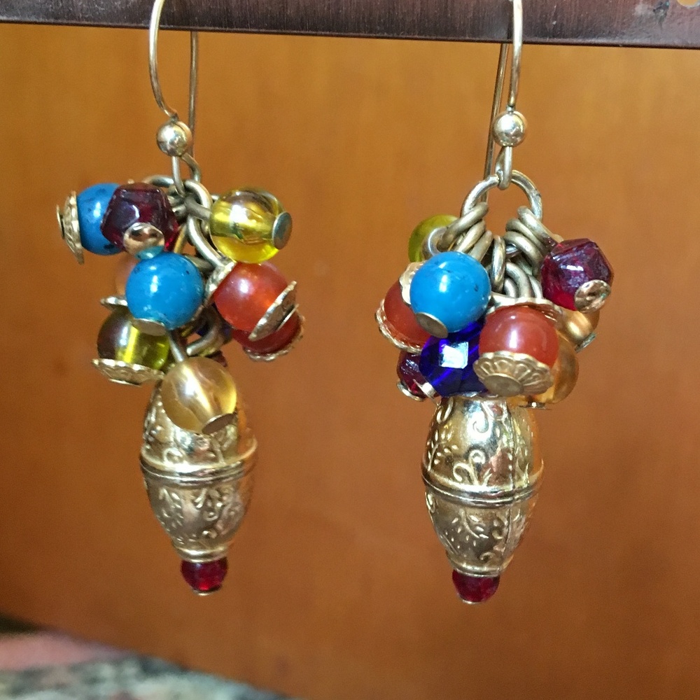 Festive gold tone earrings with multi color beads